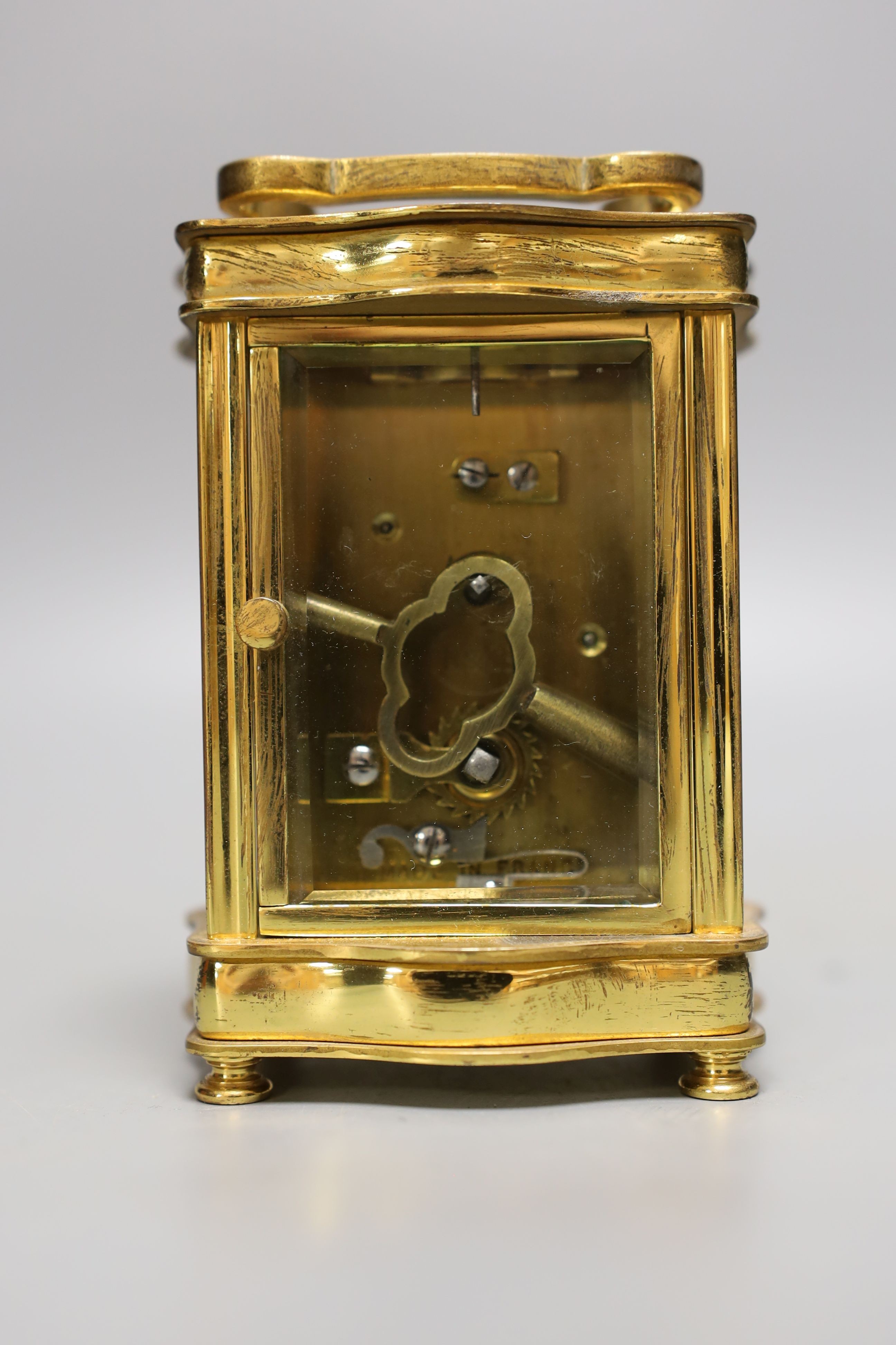 A French brass cased carriage timepiece with case. 11cm